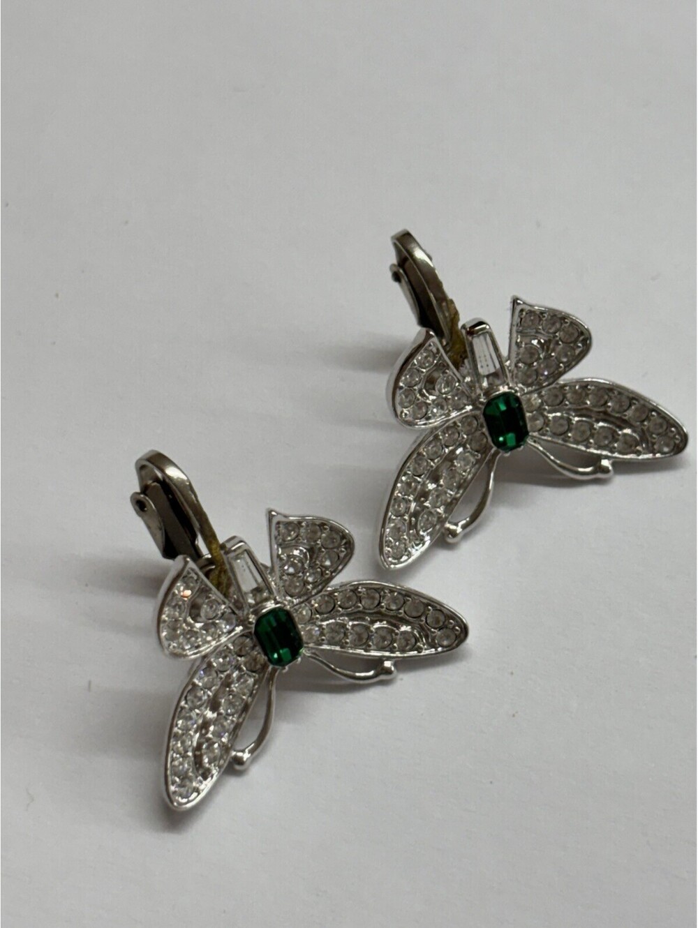 KJL butterfly clip on earrings with clear rhinestones and green accent